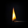 match stick flame in front of a black background Royalty Free Stock Photo