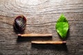 Match with a strip leaf on wooden background