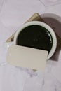 Matcha coffee latte with empty paper note copy space. Blue-green algae Chlorella and spirulina powder drink. Super Royalty Free Stock Photo