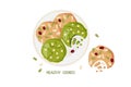 Matcha coookies with white chocolate drops and oat coookies full of pumpkin seeds, grains and dried cranberry on plate