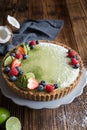 Matcha custard tart topped with fresh berries Royalty Free Stock Photo