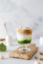 Matcha espresso. Trendy coffee drink with spirulina. Green tea coffee, matcha green tea with milk and coffee. Colorful layer drink Royalty Free Stock Photo