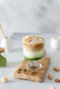 Matcha espresso. Trendy coffee drink with spirulina. Green tea coffee, matcha green tea with milk and coffee. Colorful layer drink Royalty Free Stock Photo