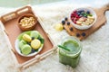 Matcha green tea, breakfast top view white background. oatmeal with berries, toasts on a wooden tray, nuts, coffee Royalty Free Stock Photo