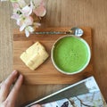 Matcha Green Tea and cookie on wooden tray. Royalty Free Stock Photo