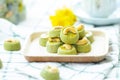 Matcha Green Tea Cookies Singapore or Matcha Green Tea cashew Cookies with a cup of hot tea blurred on green vintage background Royalty Free Stock Photo