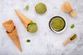 Matcha green tea ice cream with waffle cone and mint leaves  setup on white stone background . Summer and Sweet menu concept Royalty Free Stock Photo