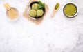 Matcha green tea ice cream with waffle cone and mint leaves  setup on white stone background . Summer and Sweet menu concept Royalty Free Stock Photo