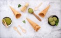 Matcha green tea ice cream with waffle cone and mint leaves  setup on white stone background . Summer and Sweet menu concept Royalty Free Stock Photo