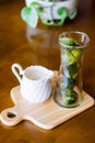 Matcha green tea ice cubes with fresh milk on wooden table Royalty Free Stock Photo