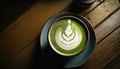 Matcha green tea with latte art foam in cup with powder on dark wooden table, latte art, hot green tea, milk, soy milk, Morning