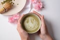 Matcha green tea latte in a bowl. Matcha is a powder of green tea leaves packed with antioxidants Royalty Free Stock Photo