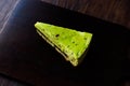 Matcha Green Tea Layer Cake Slice on Dark Wooden Board Royalty Free Stock Photo