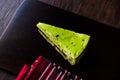 Matcha Green Tea Layer Cake Slice on Dark Wooden Board Royalty Free Stock Photo