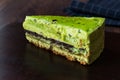 Matcha Green Tea Layer Cake Slice on Dark Wooden Board Royalty Free Stock Photo