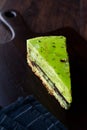 Matcha Green Tea Layer Cake Slice on Dark Wooden Board Royalty Free Stock Photo