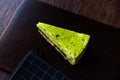 Matcha Green Tea Layer Cake Slice on Dark Wooden Board Royalty Free Stock Photo