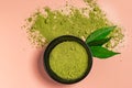 Matcha green tea powder close up on colored background