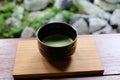 Matcha Japanese green tea served on wooden tray