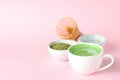 Matcha latte and accessories for making on pink background Royalty Free Stock Photo