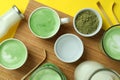 Matcha latte and accessories for making on yellow background Royalty Free Stock Photo