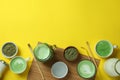 Matcha latte and accessories for making on yellow background Royalty Free Stock Photo