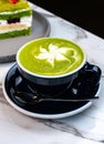 Matcha Latte with Green Cake on Marble Table Ã¢â¬\' Cozy Artisan CafÃÂ© Scene Royalty Free Stock Photo