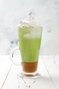Matcha latte with salted caramel in tall glass Royalty Free Stock Photo