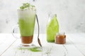 Matcha latte with salted caramel in tall glass Royalty Free Stock Photo