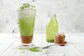 Matcha latte with salted caramel in tall glass. Royalty Free Stock Photo