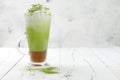 Matcha latte with salted caramel in tall glass. Royalty Free Stock Photo