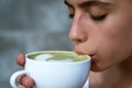 Matcha latte tea ceremony of girl. Getting warm with hot tea. perfect morning with green coffee. woman drink japanese