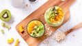 Matcha overnight oatmeal and fruits in glass, rich in protein breakfast or snack