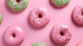 Matcha powder donuts. Pink and green matcha donuts on trendy pink background. Homemade matcha doughnuts covered with shiny green