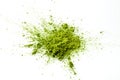 Matcha powder explosion on white background.