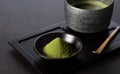 Matcha powder and green tea on dark background Royalty Free Stock Photo