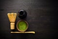 Matcha powder. Organic green matcha tea ceremony. Healthy drink. Traditional japanese drink on black wooden background Royalty Free Stock Photo