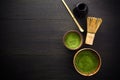 Matcha powder. Organic green matcha tea ceremony. Healthy drink. Traditional japanese drink on black wooden background Royalty Free Stock Photo
