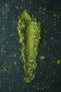 matcha powder tea on a stone surface