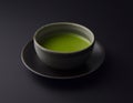 Matcha tea in the cup isolated on black background. Japanese tea ceremony concept. Royalty Free Stock Photo