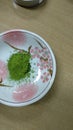 Matcha tea in a cup on a wooden table. Top view Royalty Free Stock Photo