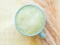 Matcha tea latte morning antioxidant hot drink in blue cup