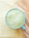 Matcha tea latte morning antioxidant hot drink in blue cup Royalty Free Stock Photo