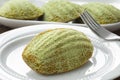 Matcha tea madeleine close up on a dish