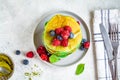 Matcha tea pancakes with berries, white background, top view. Healthy vegan food concept Royalty Free Stock Photo