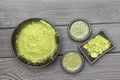 Matcha tea in two bowls. Green matcha tea powder in black bowl. Flat l