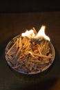 Lighting many matches in a metallic holder