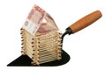 Matches and currency on a building trowel Royalty Free Stock Photo