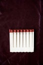 Matches on deep red background Royalty Free Stock Photo
