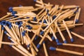 Matches with the match part or blue head, grouped on a wooden table. 2